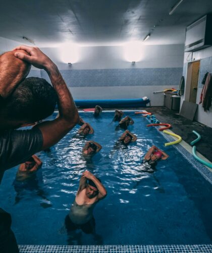 people stretching inside pool room
